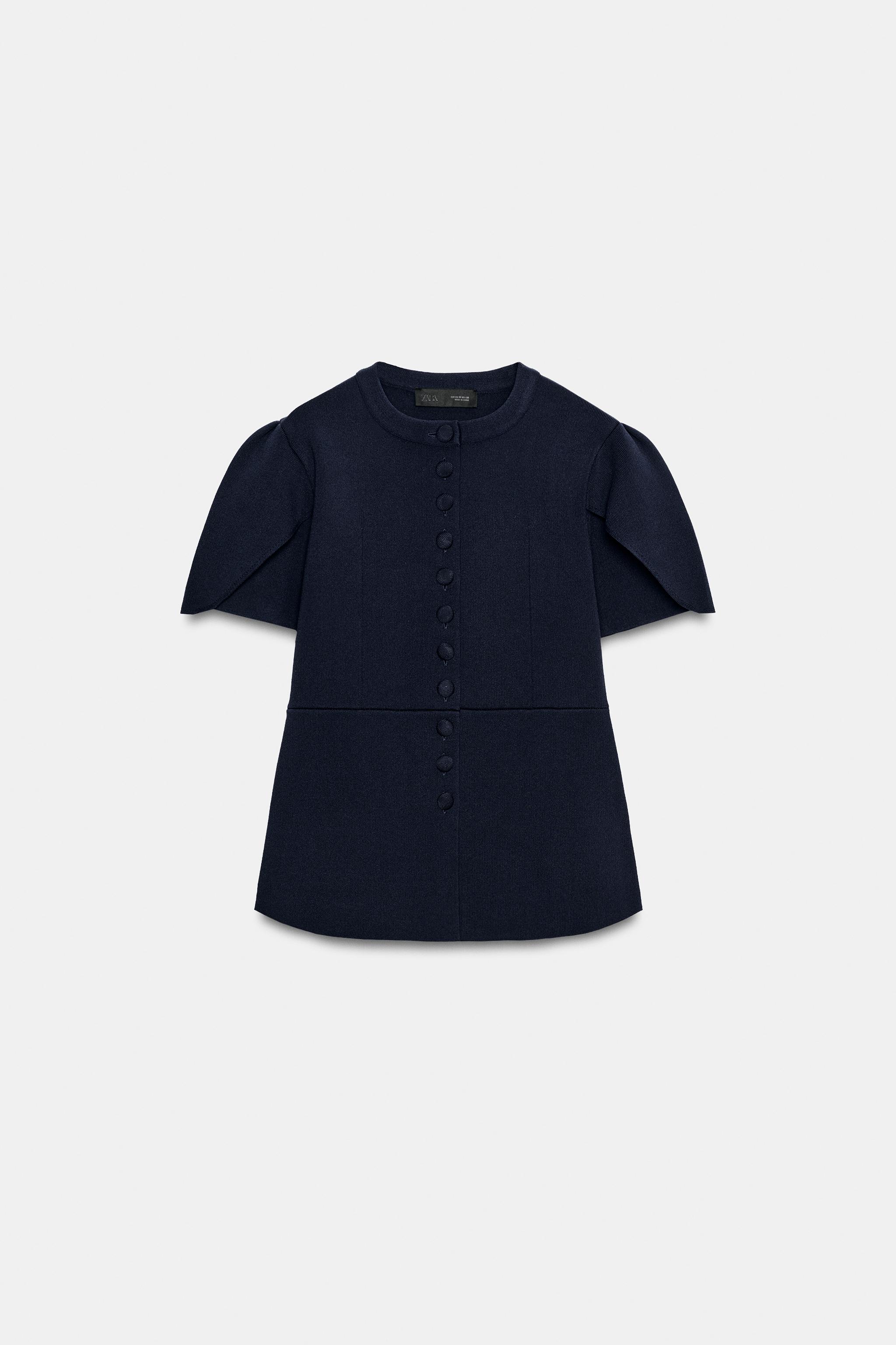 VESTE EN MAILLE À MANCHES BOUFFANTES ET OUVERTURES